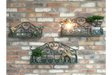 Set of 3 green wrought iron wall shelves with decorative scrollwork, displayed on a brick wall with small plants and