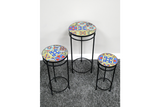 Set of 3 round side tables with black metal legs and colorful patterned tile tops, shown from a top angled view.