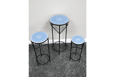 Set of 3 round side tables with blue patterned ceramic tops and black metal legs on gray carpet.