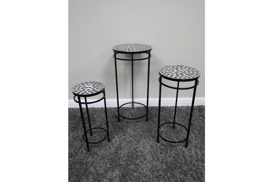 Set of 3 side tables with black metal frames and round mosaic tops in black and white, displayed on grey carpet.