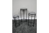 Set of 3 side tables with black metal frames and round mosaic tops in black and white, displayed on grey carpet.