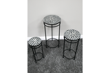 Set of 3 round side tables with black metal frames and mosaic tile tops in black and white on gray carpet.