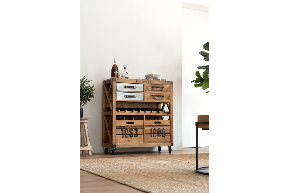 Wooden wine cabinet with metal drawer fronts, multiple drawers, wine bottle storage, and caster wheels, angled view.