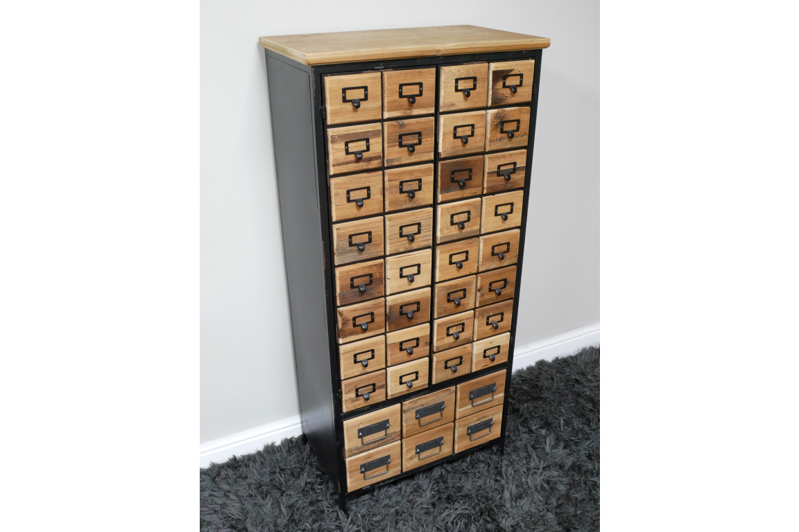 Tall storage cabinet with multiple small wooden drawers and black metal frame, angled view on gray carpet.