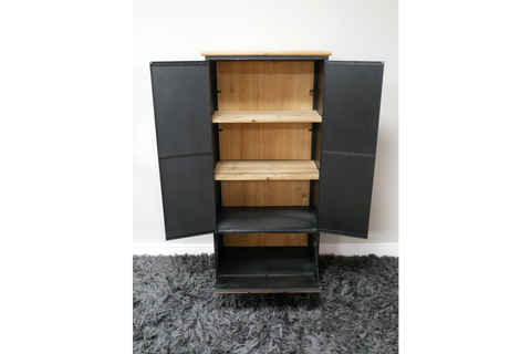 Black metal storage cabinet with light wood shelves, open doors, standing on gray carpet against white wall.