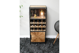 Tall wine cabinet with black metal frame, light wood shelves and decorative door, displayed on gray carpet.