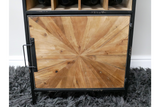 Wine cabinet with black metal frame, light wood geometric patterned door, standing on grey shaggy rug, front view.