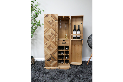 Tall wooden wine cabinet with geometric pattern doors, multiple wine bottle slots, glass holders, and open compartments.