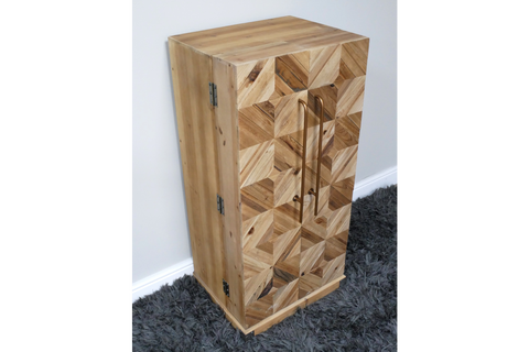Wooden wine cabinet with geometric patterned front, bronze handles, viewed from a side angle on grey carpet.