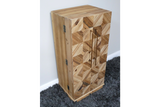 Wooden wine cabinet with geometric patterned front, bronze handles, viewed from a side angle on grey carpet.