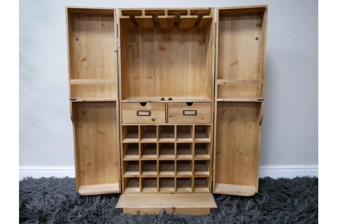 Light wood wine cabinet with open double doors, row of bottle slots, two drawers, and hanging rack, front view.