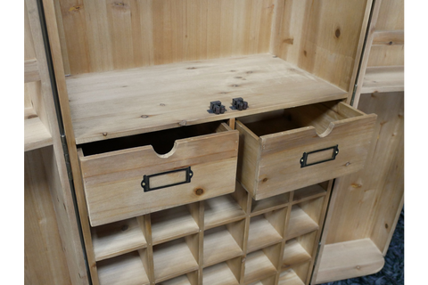Light wood wine cabinet with two open drawers, grid-style cubbyholes for bottles, shown at a slight angle.