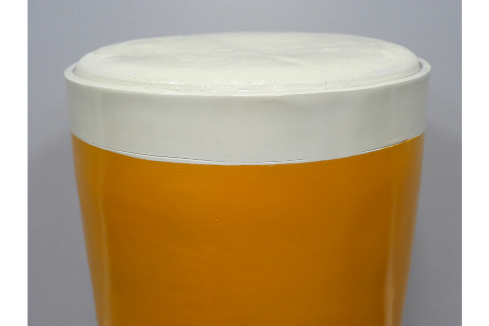 Round Lager Side Table in glossy amber and cream finish, top-down close-up view showing smooth surface detail.