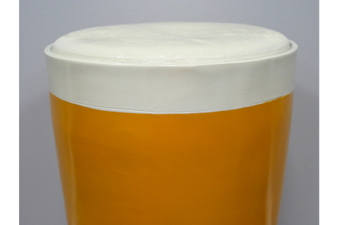 Round Lager Side Table in glossy amber and cream finish, top-down close-up view showing smooth surface detail.
