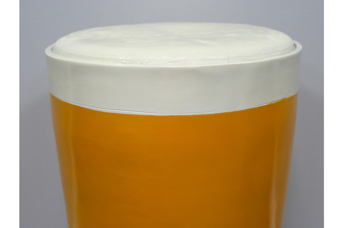 Round Lager Side Table in glossy amber and cream finish, top-down close-up view showing smooth surface detail.