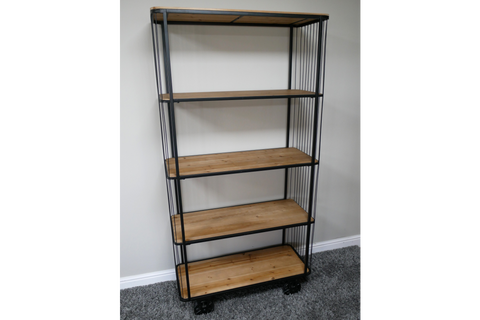 Tall shelving unit with five wooden shelves, black metal frame, and wheels on a grey carpeted floor.