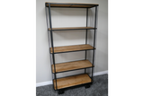 Tall shelving unit with five wooden shelves, black metal frame, and wheels on a grey carpeted floor.