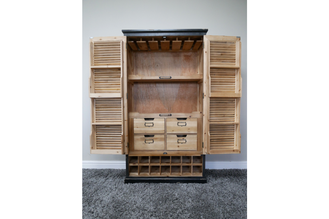 Wooden shutter bar cabinet with natural and black finish, open front showing shelves, drawers, and bottle slots, front view.