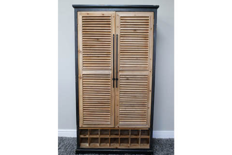 Tall wooden shutter bar cabinet with natural wood louvered doors, black frame, and built-in wine storage compartments.