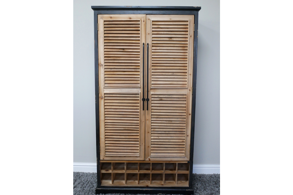 Tall wooden shutter bar cabinet with natural wood louvered doors, black frame, and built-in wine storage compartments.