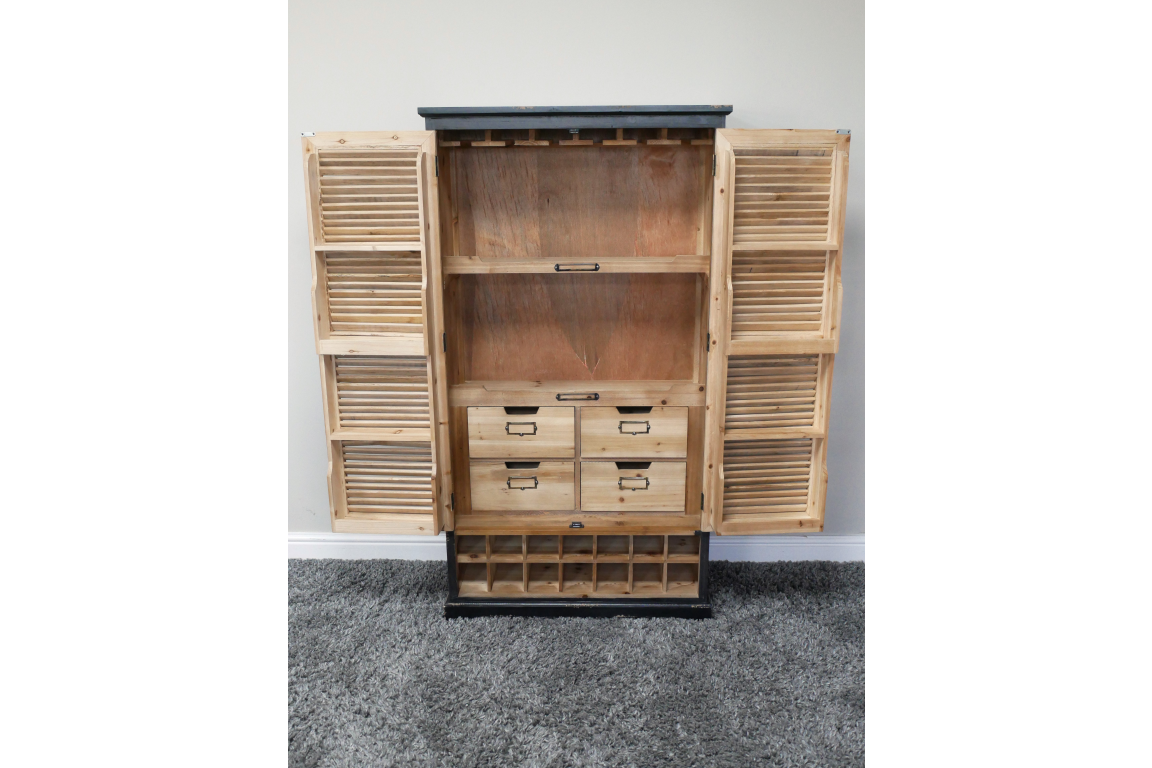 Wooden shutter bar cabinet with louvered doors open, four small drawers, wine rack base, natural and black finish, front view