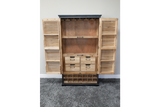 Wooden shutter bar cabinet with louvered doors open, four small drawers, wine rack base, natural and black finish, front view