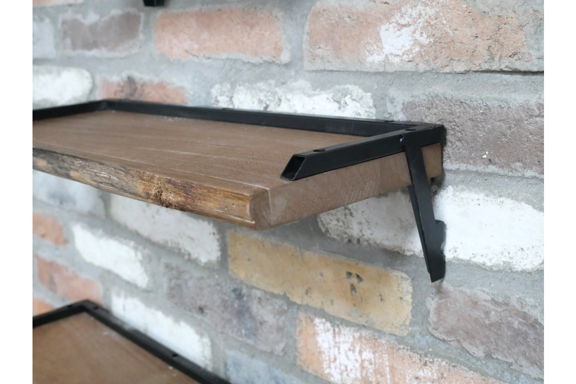Set of 3 rustic wood wall shelves with black metal frame brackets, mounted on exposed brick wall, angled side view.