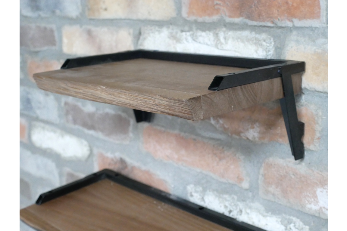 Set of 3 wall shelves with natural wood surfaces and black metal brackets mounted on a brick wall, side angle view.