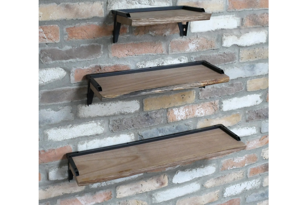 Set of 3 rectangular wooden wall shelves with black metal brackets, mounted on a textured brick wall, side angled view.