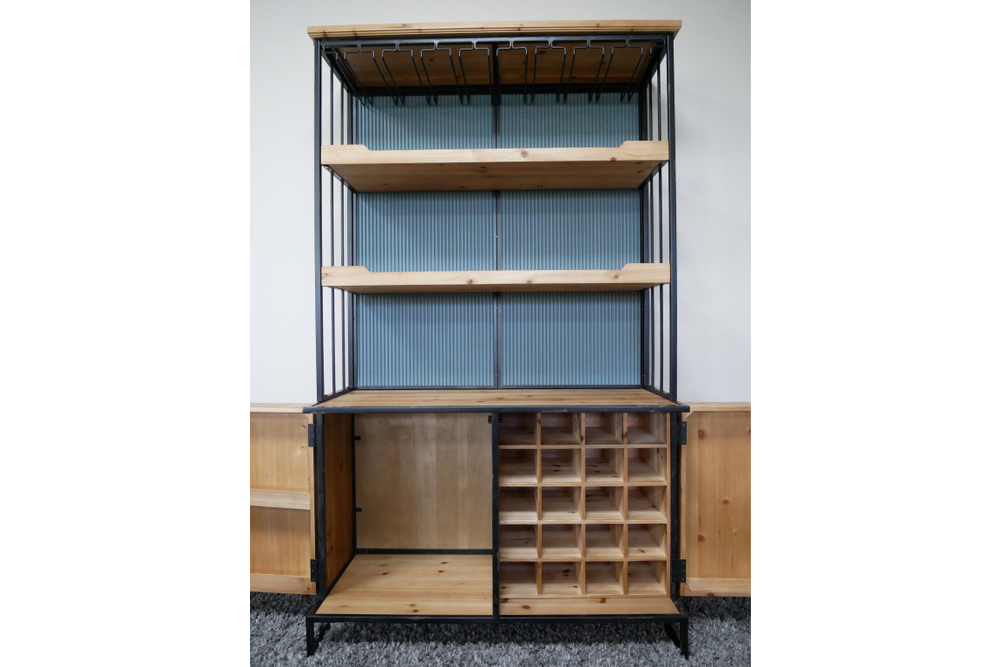 Tall bar cabinet with black metal frame, natural wood shelves, wine bottle slots, and ribbed blue back panel, front view.