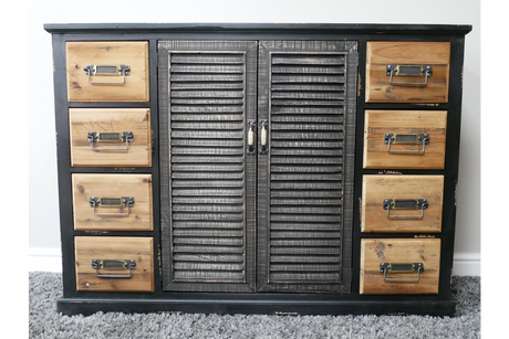 Shutter Sideboard with black frame, natural wood drawers, louvered doors, front view on gray carpet background
