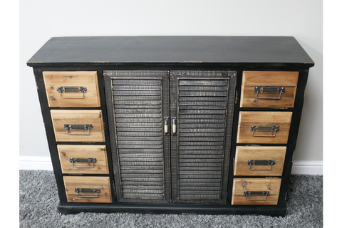 Black wooden sideboard with shutter-style doors in the center and natural wood drawers on each side, front view.