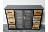 Black wooden sideboard with shutter-style doors in the center and natural wood drawers on each side, front view.