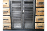 Shutter Sideboard with black shutter-style doors and natural wood drawers with metal handles, front view.