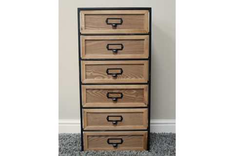 Tall industrial drawer cabinet with six wooden drawers framed by black metal, shown front view on gray carpet.