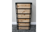 Industrial drawer cabinet with five light wood drawers and black metal frame, front view on carpeted floor.
