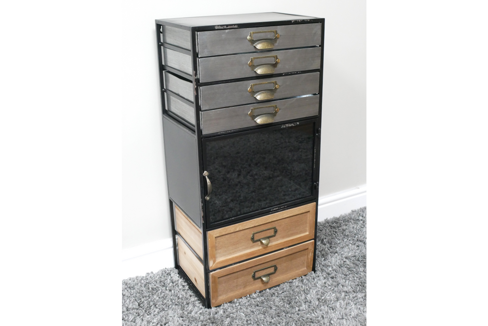 Tall industrial drawer cabinet with mixed wood and metal drawers, black metal frame, angled view on carpeted floor.