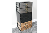 Tall industrial drawer cabinet with mixed wood and metal drawers, black metal frame, angled view on carpeted floor.