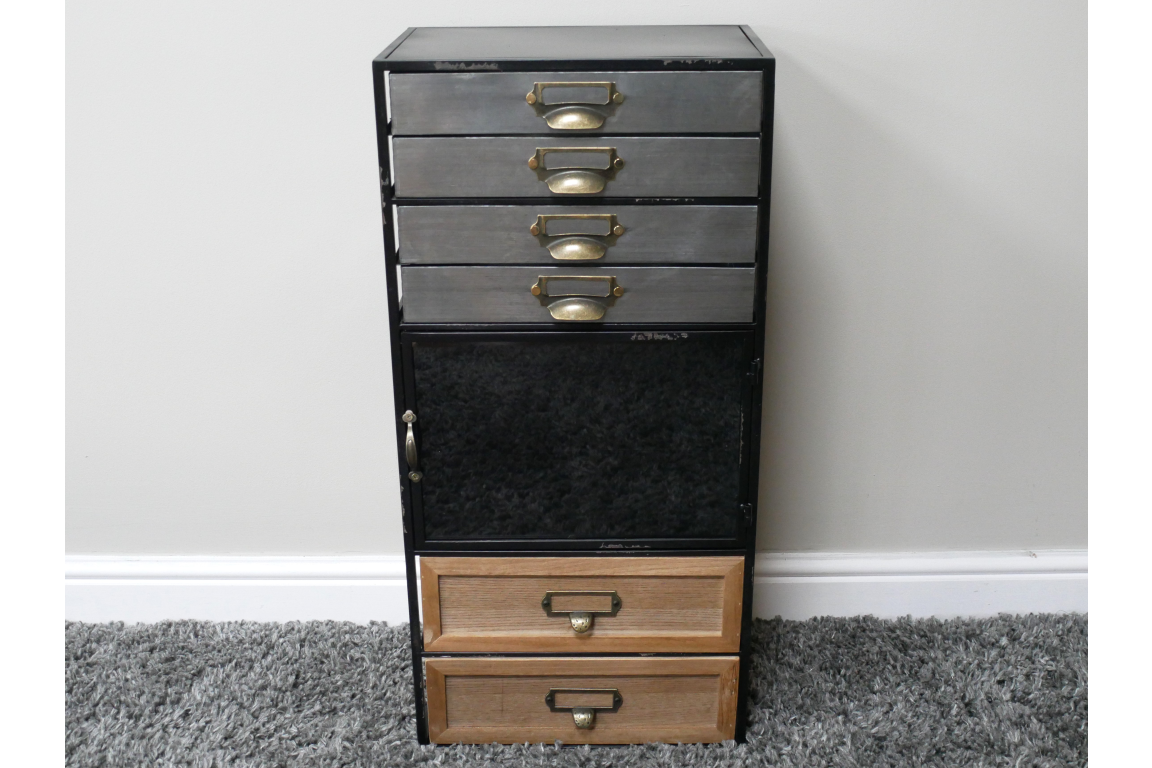 Industrial drawer cabinet with black metal frame, four gray metal drawers, one black door, two wooden drawers, front view.