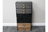 Industrial drawer cabinet with black metal frame, four gray metal drawers, one black door, two wooden drawers, front view.