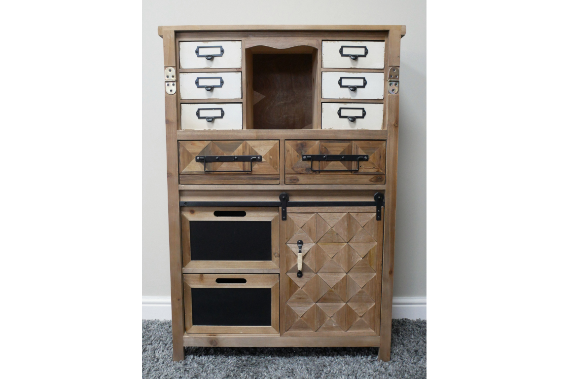 Rustic wooden cabinet with mixed drawers, blackboard panels, sliding door, and metal handles, front view on carpeted floor.