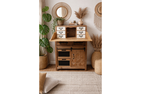 Rustic wooden cabinet with small white drawers, black metal handles, and a folding top panel in a boho room setting.