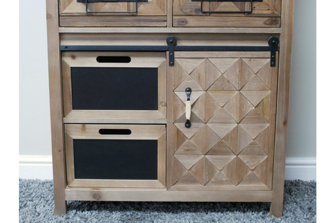 Rustic wooden cabinet with geometric patterned door, two black drawer fronts, metal handle, and sliding rail, front view.