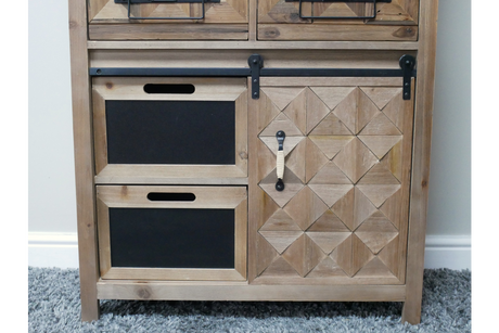 Rustic wooden cabinet with geometric patterned door, two black drawer fronts, metal handle, and sliding rail, front view.