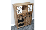 Rustic wooden cabinet with multiple drawers, white and wood finishes, black handles, and a textured door, angled view.