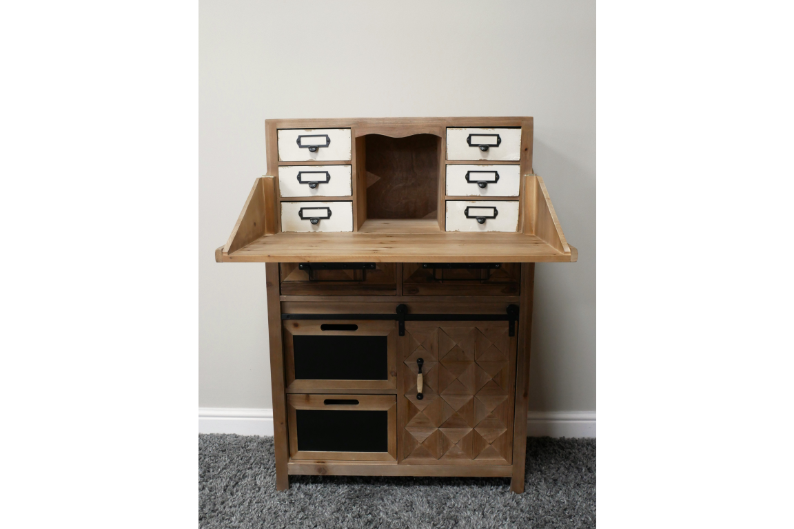 Rustic wooden cabinet with six small white drawers, two blackboard panels, and a side door with geometric patterns.