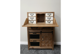 Rustic wooden cabinet with six small white drawers, two blackboard panels, and a side door with geometric patterns.