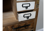 Rustic wooden cabinet with white distressed drawers, black metal handles, and a natural wood finish, shown from a side angle.