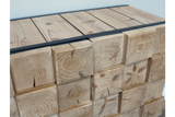 Chunky wooden cabinet with natural wood grain and knots, front angled view, metal top edges, light wood finish.