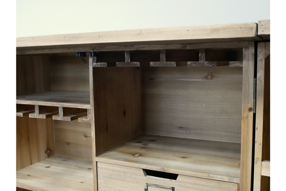 Light brown wooden Shutter Bar Cabinet with open shelves and glass holders, shown from a front angle.
